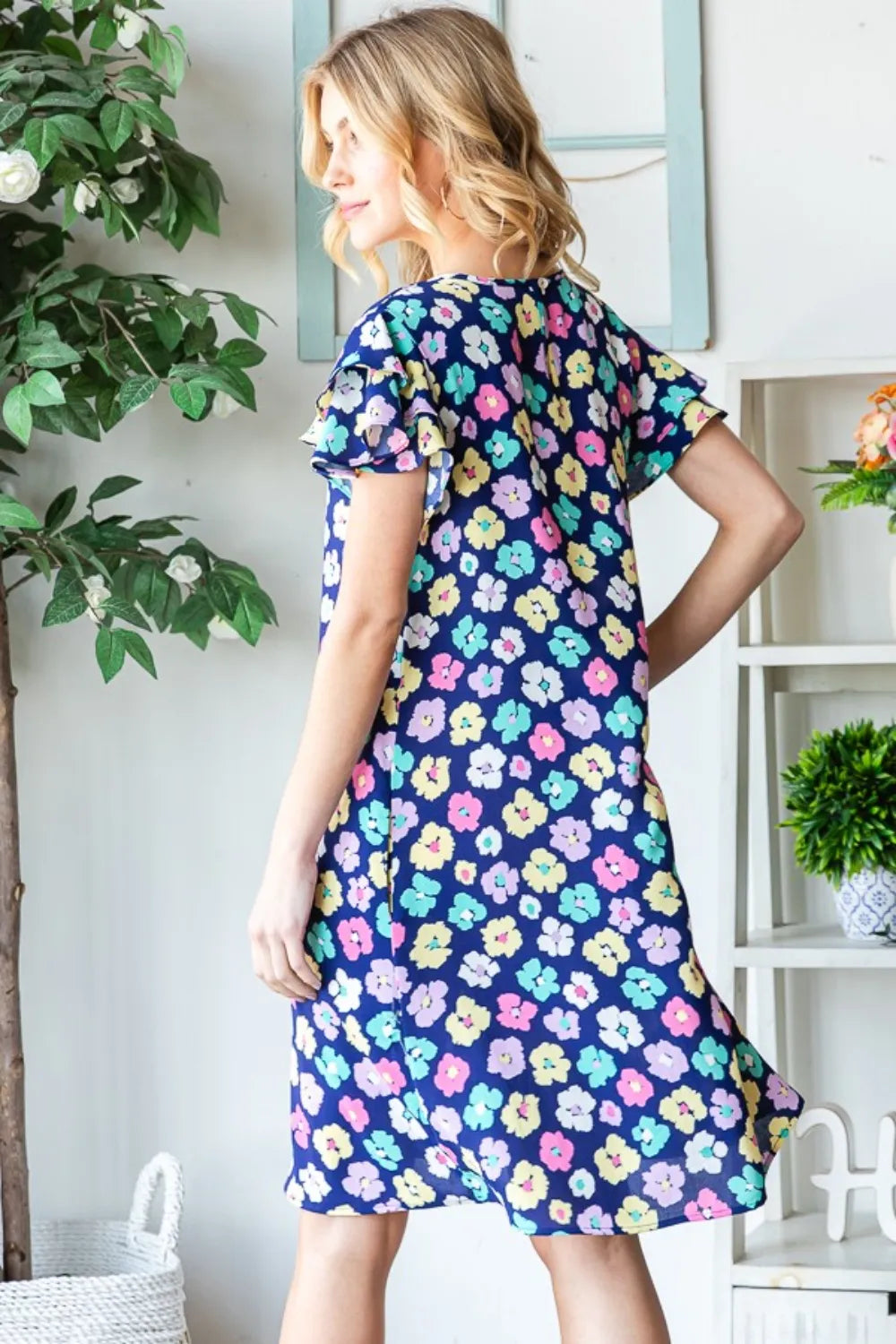 Heimish floral ruffled short sleeve dress with pockets, featuring a full-length design in a stylish, feminine pattern.