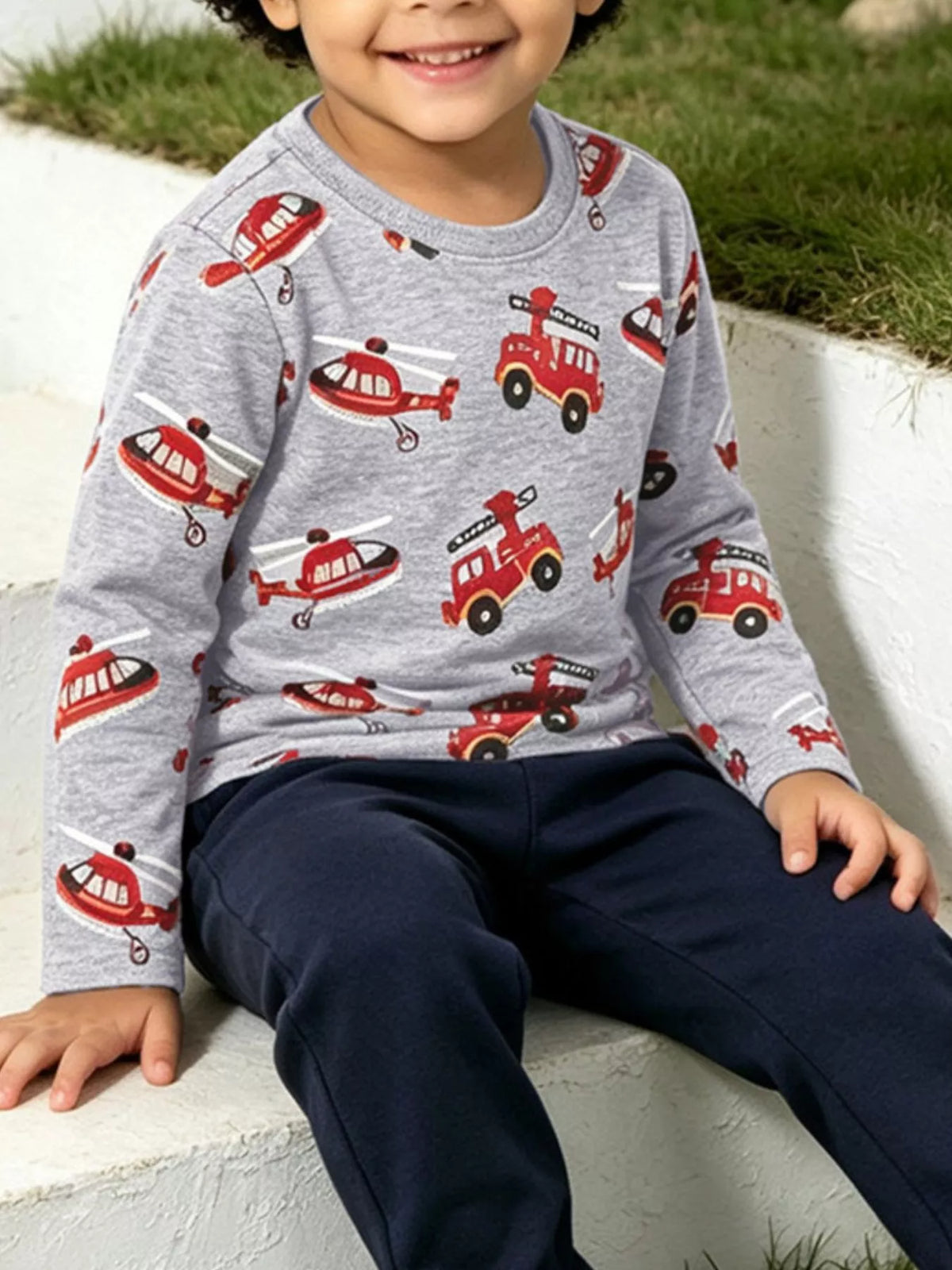 Children's fire truck and helicopter print long sleeve crew neck T-shirt by Trendsi, featuring colorful vehicle illustrations on soft fabric.