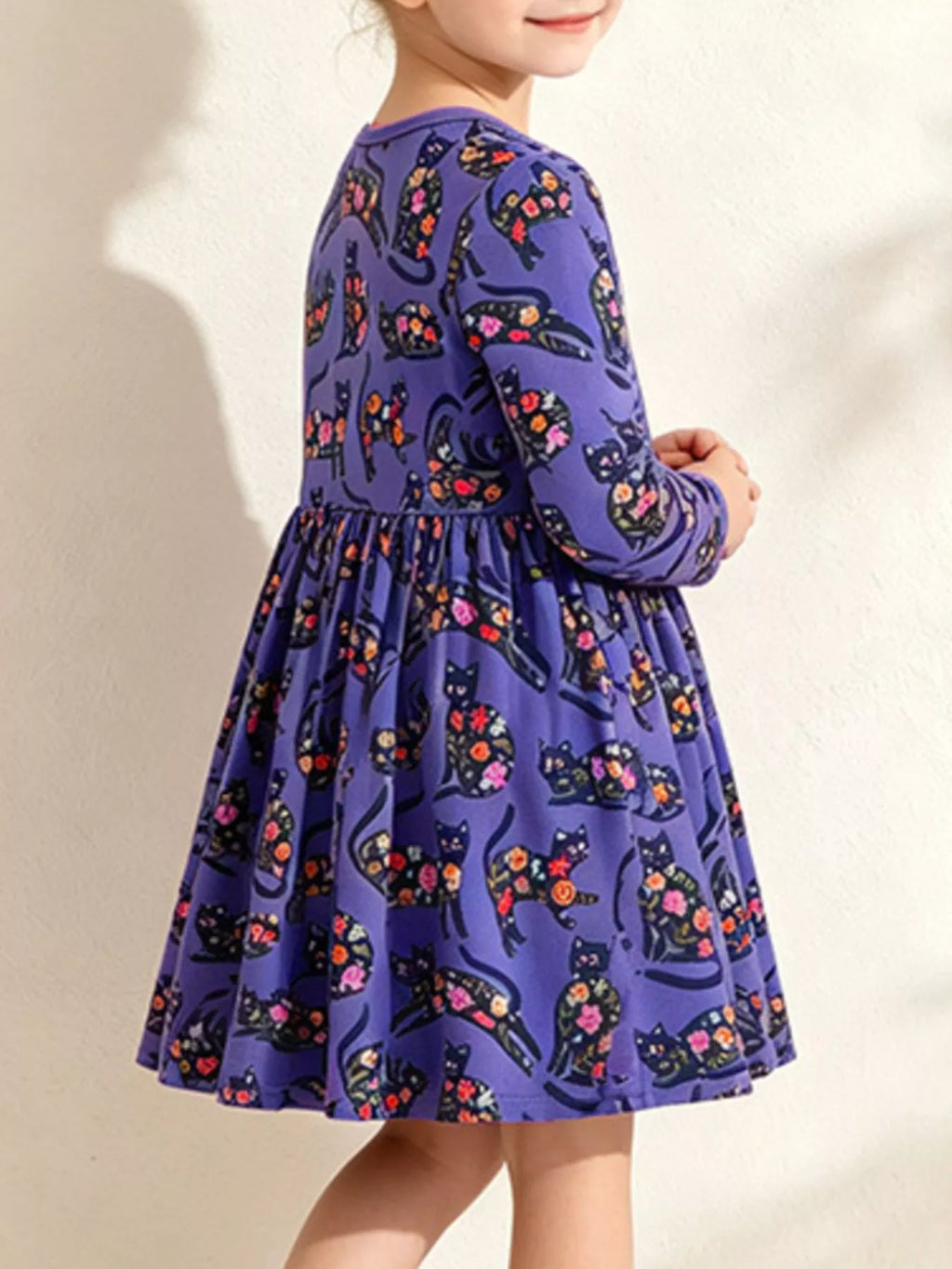 Children's floral cat print long-sleeve A-line casual dress by Trendsi, featuring a charming floral and cat pattern in vibrant colors.