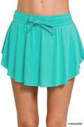 Zenana Ruffle Hem Tennis Skirt with hidden inner pockets, featuring a stylish ruffle hem and comfortable fit.