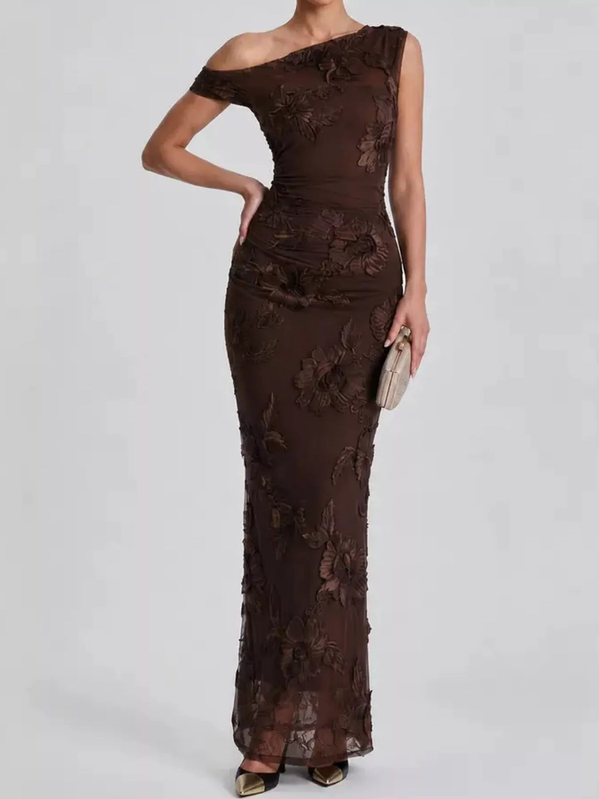 One-shoulder floral embroidered maxi dress by Trendsi featuring colorful floral embroidery and flowing fabric.