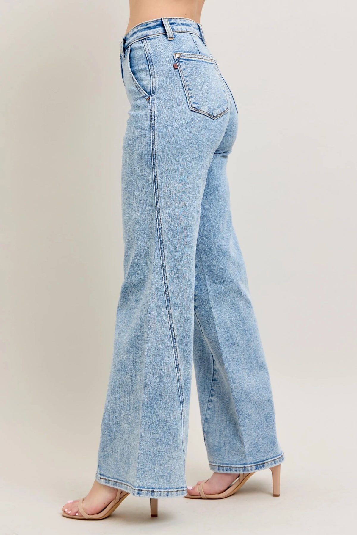 Trendsi Judy Blue high waist wide leg jeans with skewed inseam, full size plus size denim pants displayed on a model.