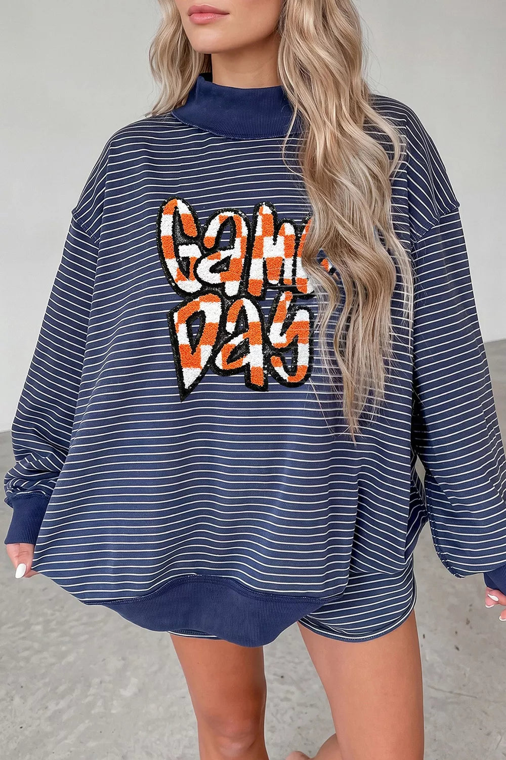 Stripe GAME DAY letter print long sleeve and graphic shorts set by Trendsi, featuring bold stripes and sporty design.