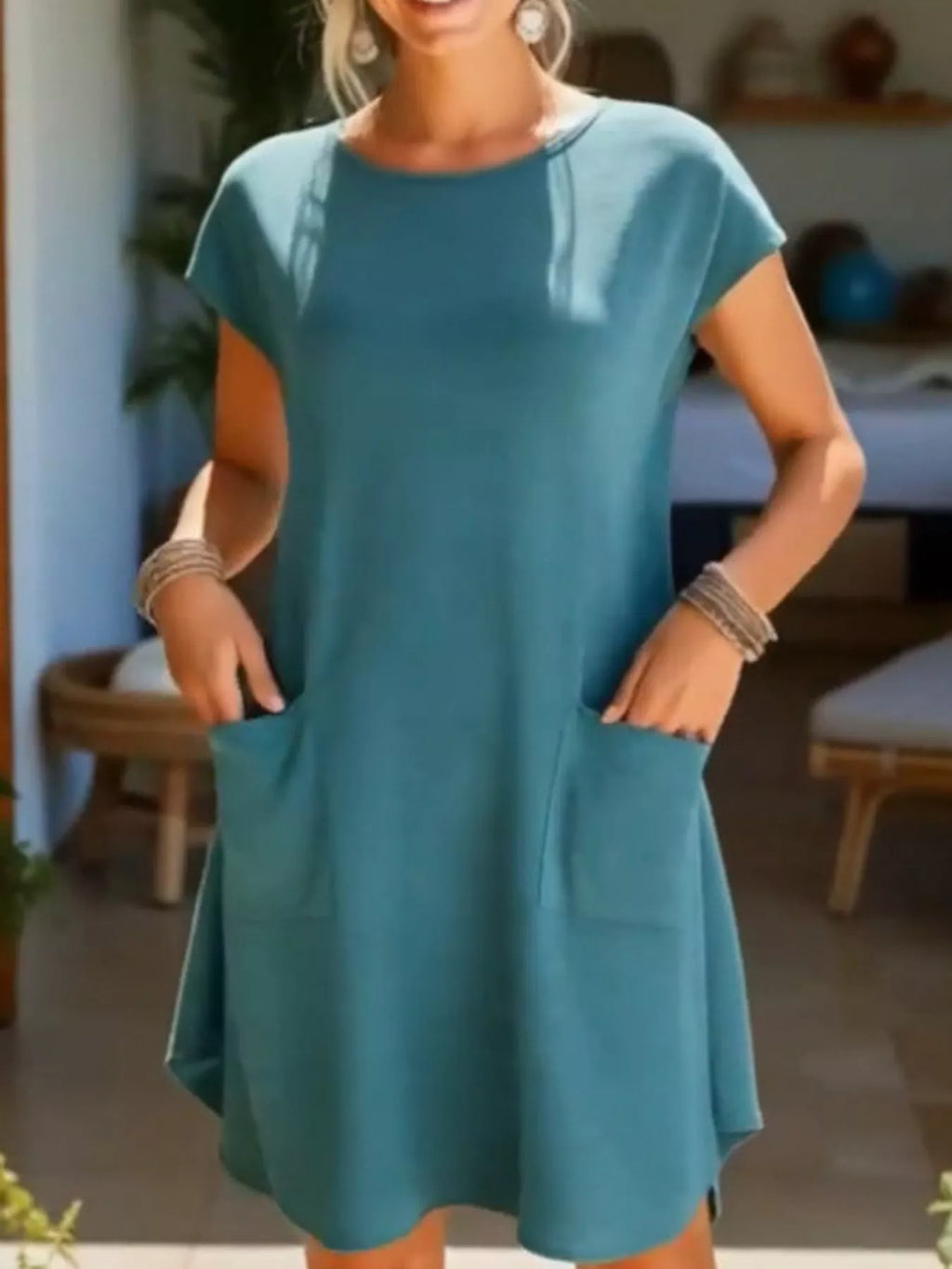 Loose fit T-shirt dress with pockets from Trendsi, featuring a relaxed silhouette and casual style, shown in the product image.