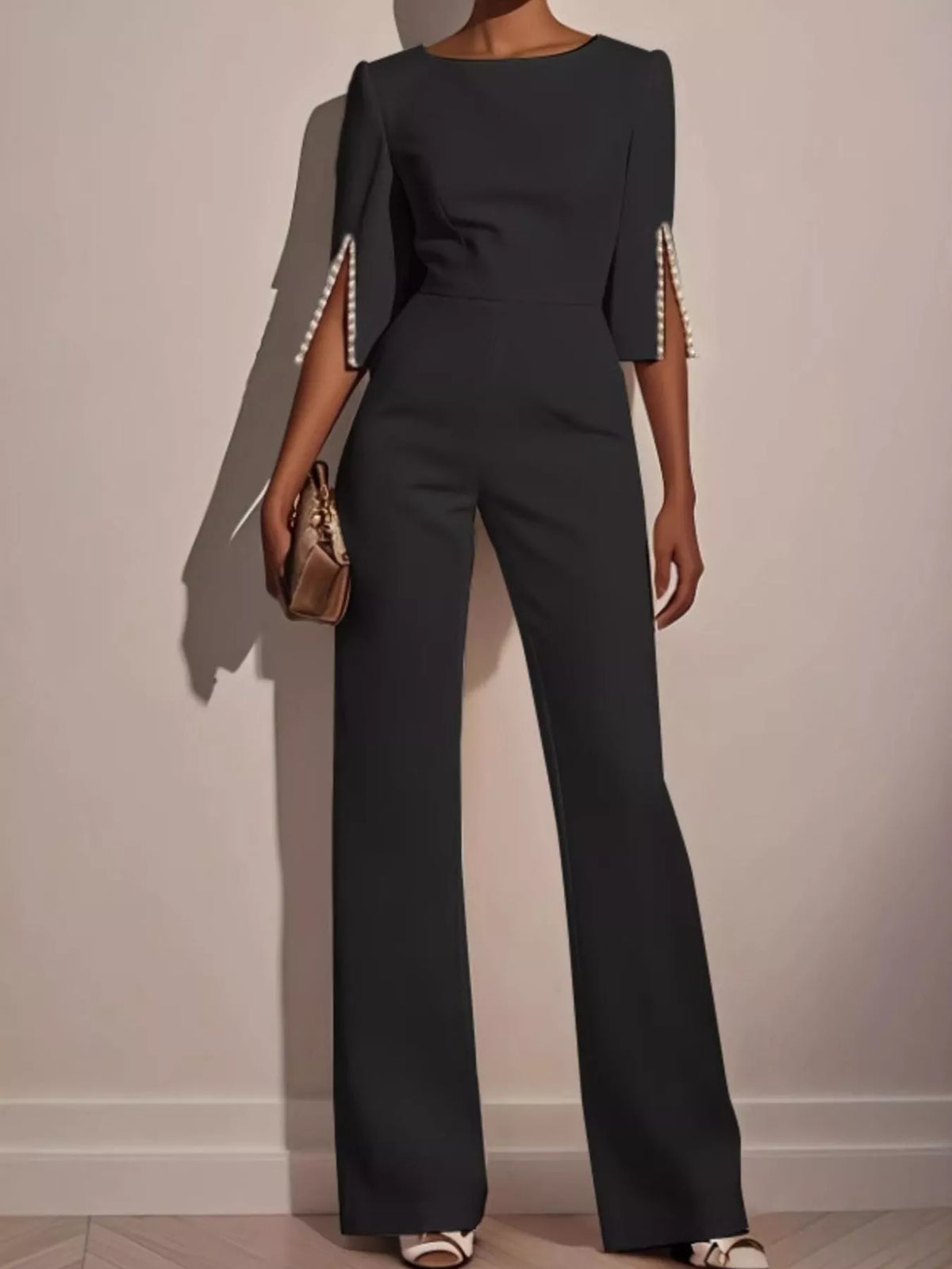 Trendsi wide-leg jumpsuit with slit sleeves, featuring a flowing silhouette and stylish design, shown in the product image.