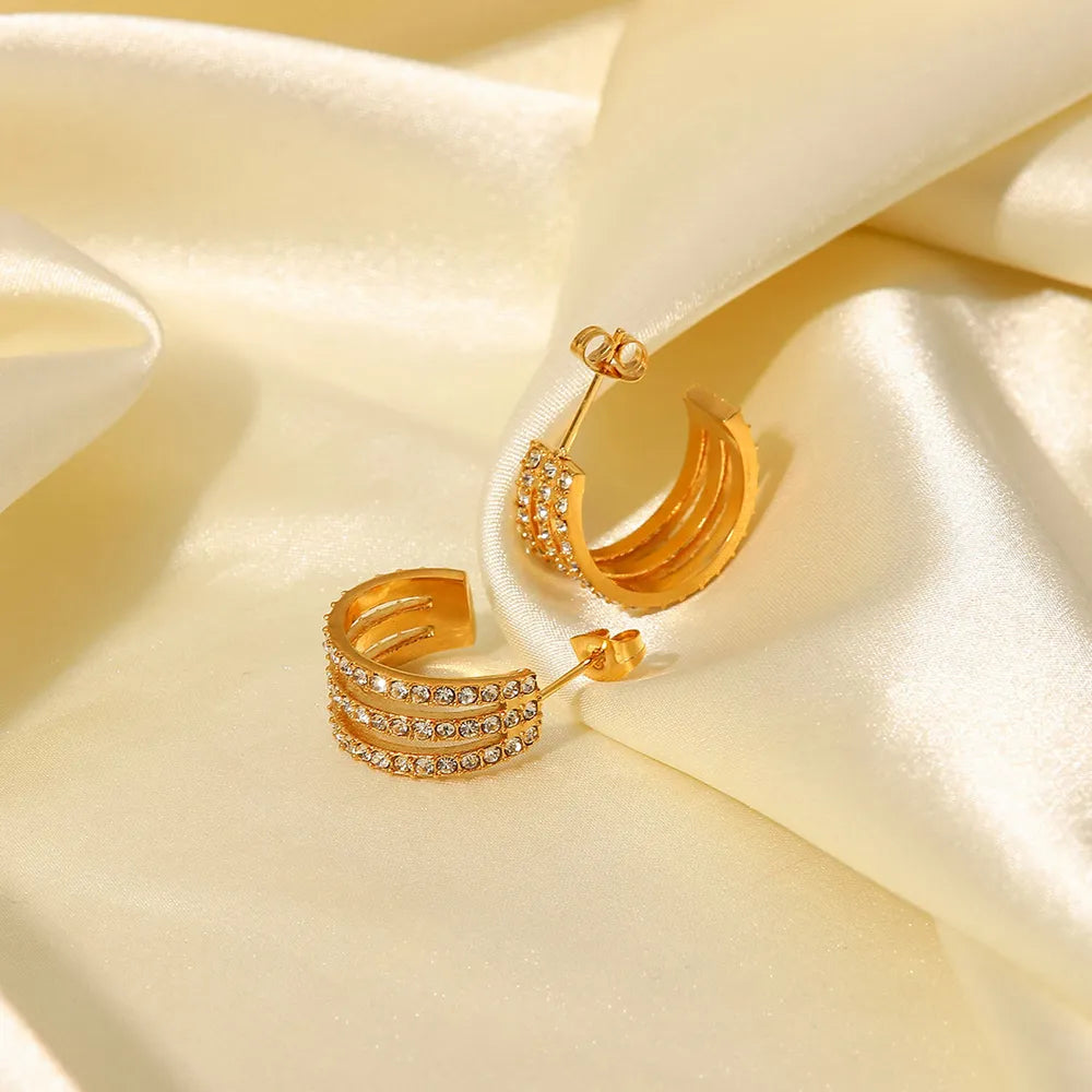 Stainless steel inlaid zircon C-hoop earrings featuring sparkling zircon accents and a sleek, modern design.