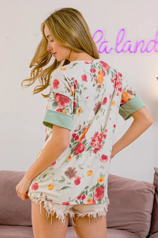 Trendsi BiBi floral button detail round neck short sleeve terry T-shirt with colorful floral pattern and casual fit.