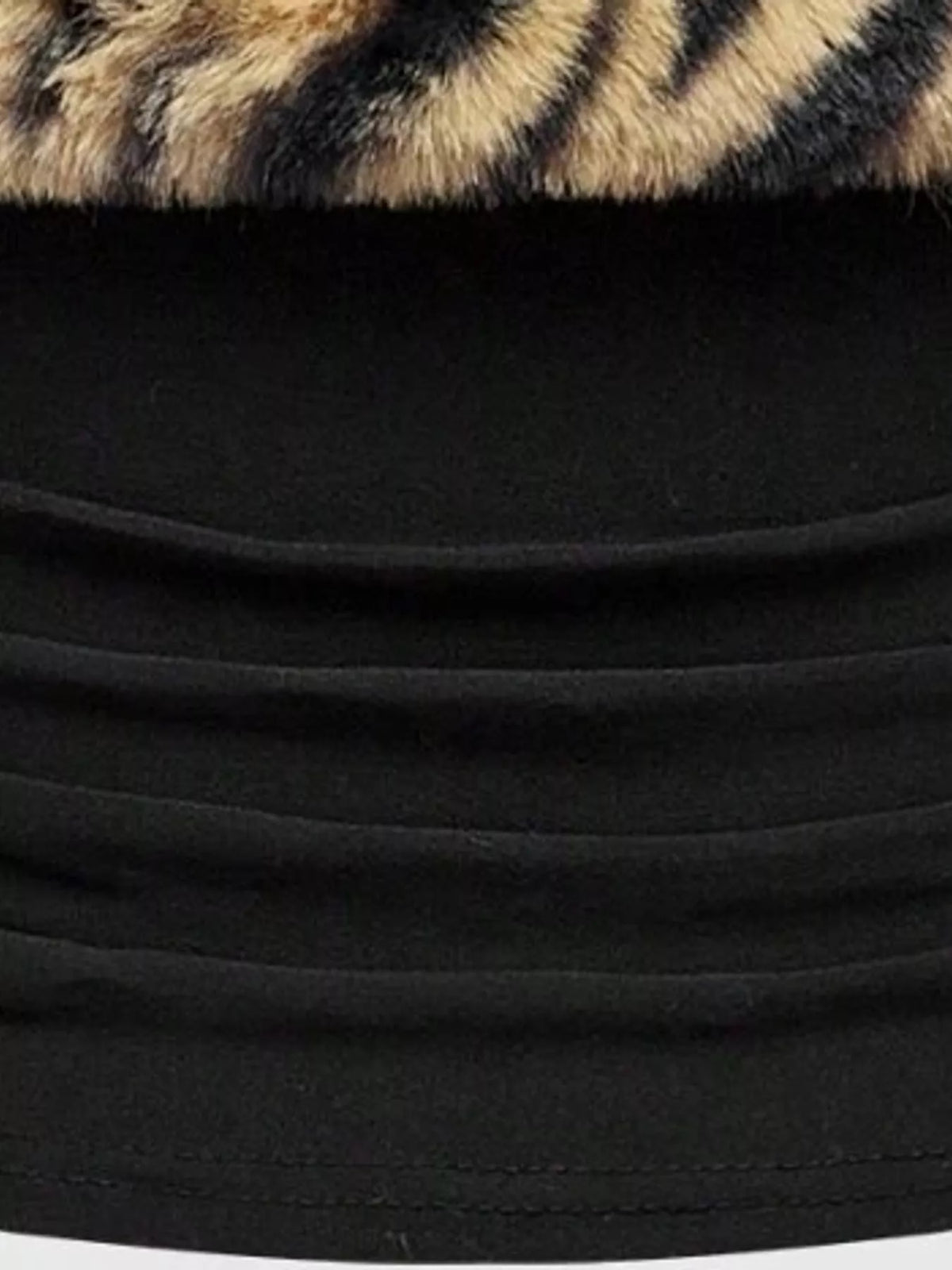 Zebra print faux fur trimmed tube top by Trendsi, featuring bold black and white animal pattern and plush fur accents.