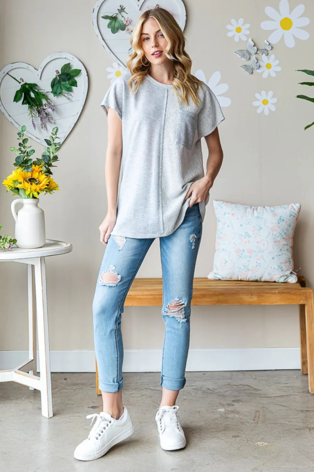 Heimish full size pocketed round neck short sleeve T-shirt from Trendsi, featuring a classic fit and casual style in a neutral color.