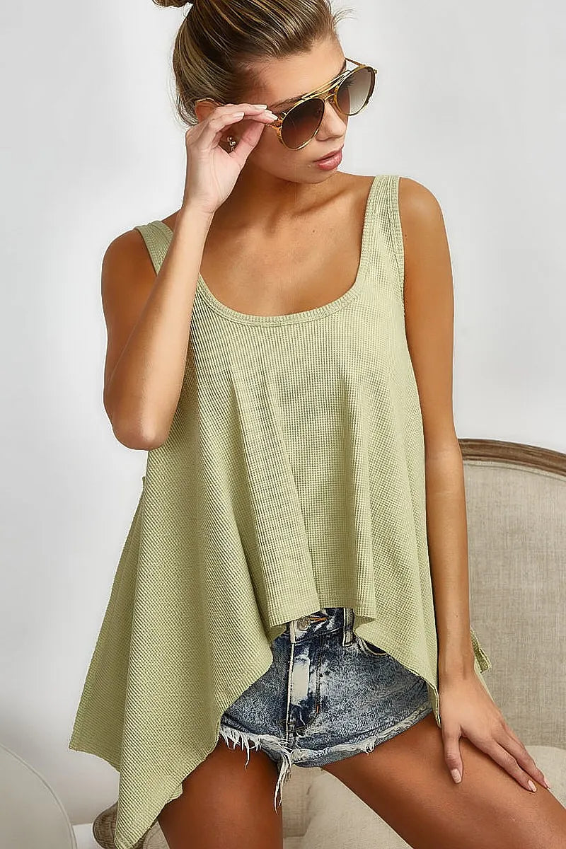 BiBi high and low flare knit tank top by Trendsi, featuring a stylish sleeveless design with a fitted high-low silhouette.