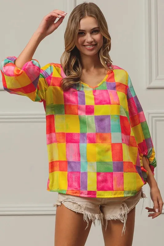 Colorful BiBi Multi Block Bubble Pop Balloon top featuring vibrant blocks and playful bubble design, perfect for fun and casual wear.