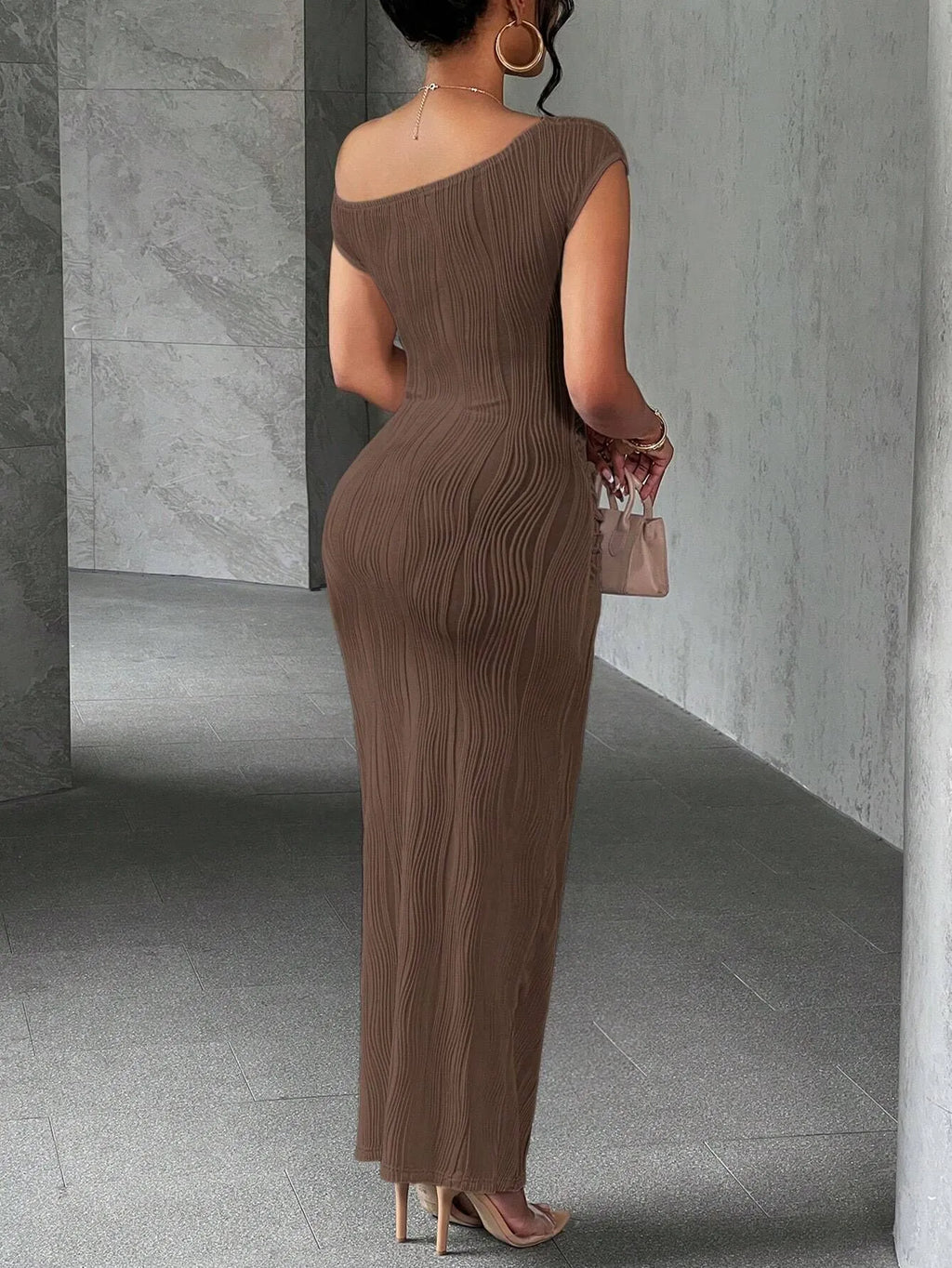 Asymmetrical one-shoulder bodycon maxi dress by Trendsi featuring a sleek, fitted silhouette and stylish design.