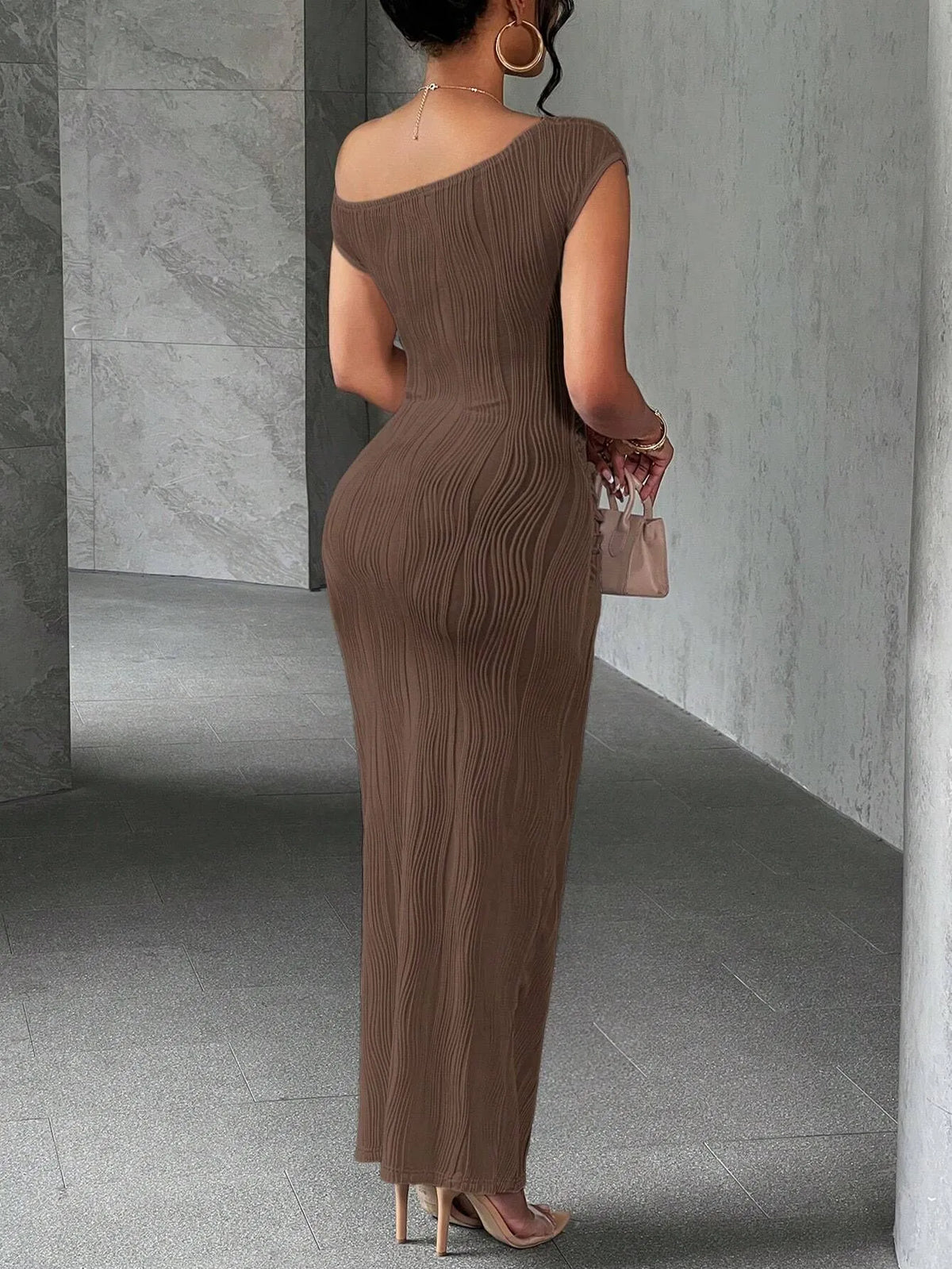 Asymmetrical one-shoulder bodycon maxi dress by Trendsi featuring a sleek, fitted silhouette and stylish design.