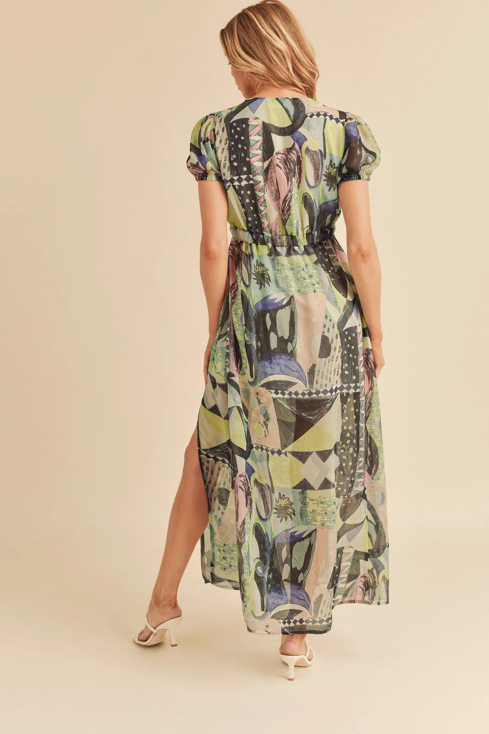 Aemi + Co lace detail slit geometric print short sleeve maxi dress, showing the flowing fabric and stylish design.