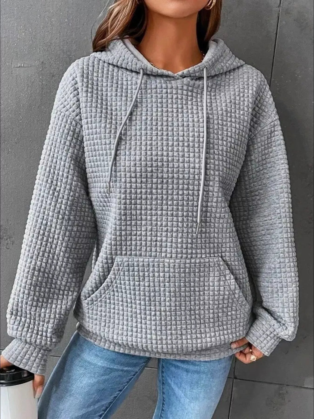 Plus size textured kangaroo pocket hoodie from Trendsi, showing the full front view with a cozy, casual fit and soft fabric details.