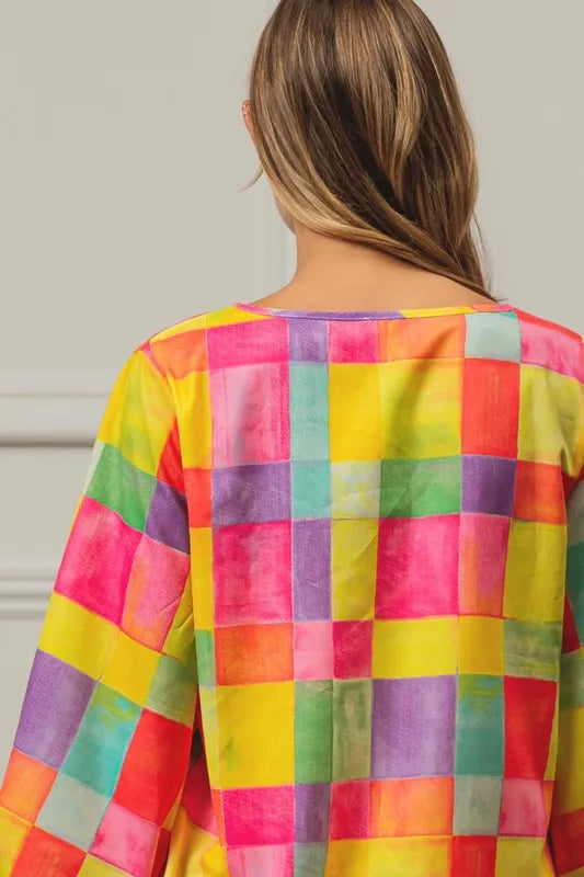 Colorful BiBi Multi Block Bubble Pop Balloon Top by Trendsi, featuring vibrant, playful bubble designs on a lightweight fabric.