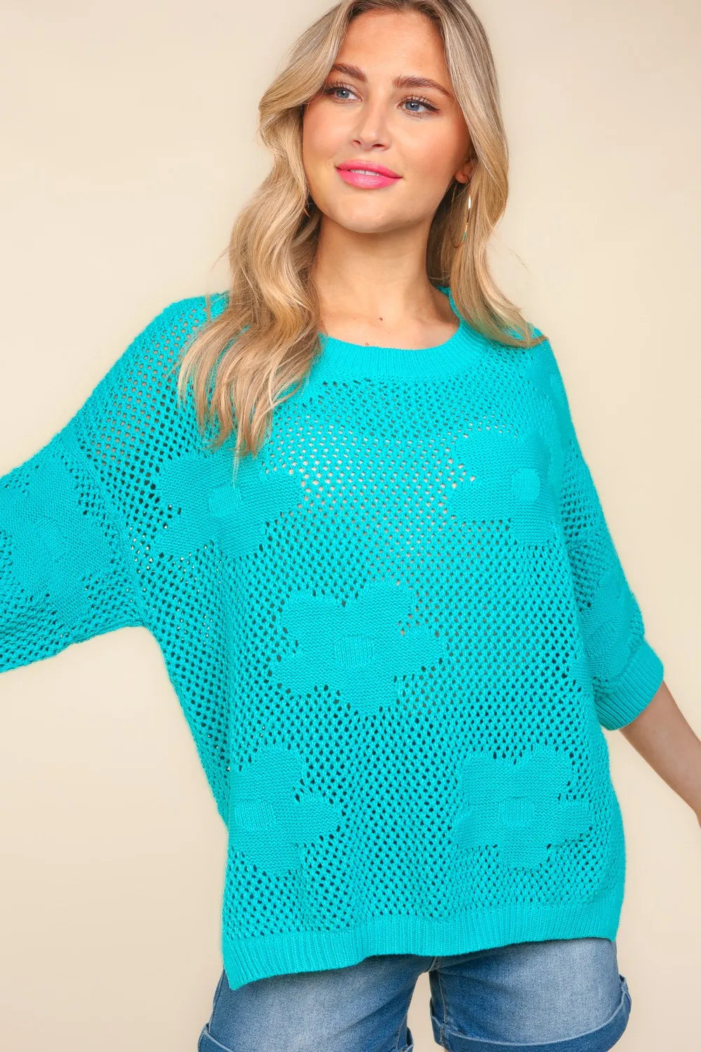 Haptics Floral Crochet Side Slit Knit Top by Trendsi featuring a floral pattern, crochet details, and a side slit in soft knit fabric
