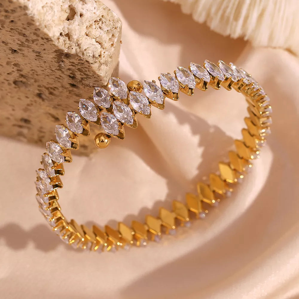 Gold-plated zircon bracelet and ring jewelry set with sparkling stones, stylish accessories for elegant occasions.