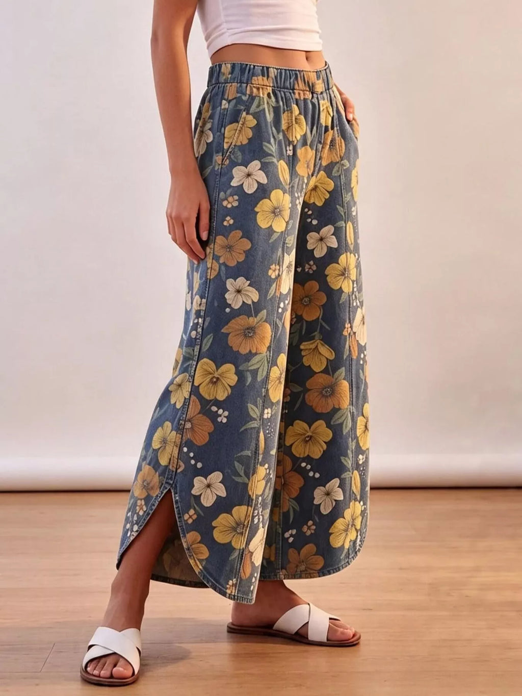Floral print elastic waist wide-leg jeans from Trendsi, featuring a relaxed fit and vibrant floral design.