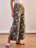 Floral print elastic waist wide-leg jeans from Trendsi, featuring a relaxed fit and vibrant floral design.