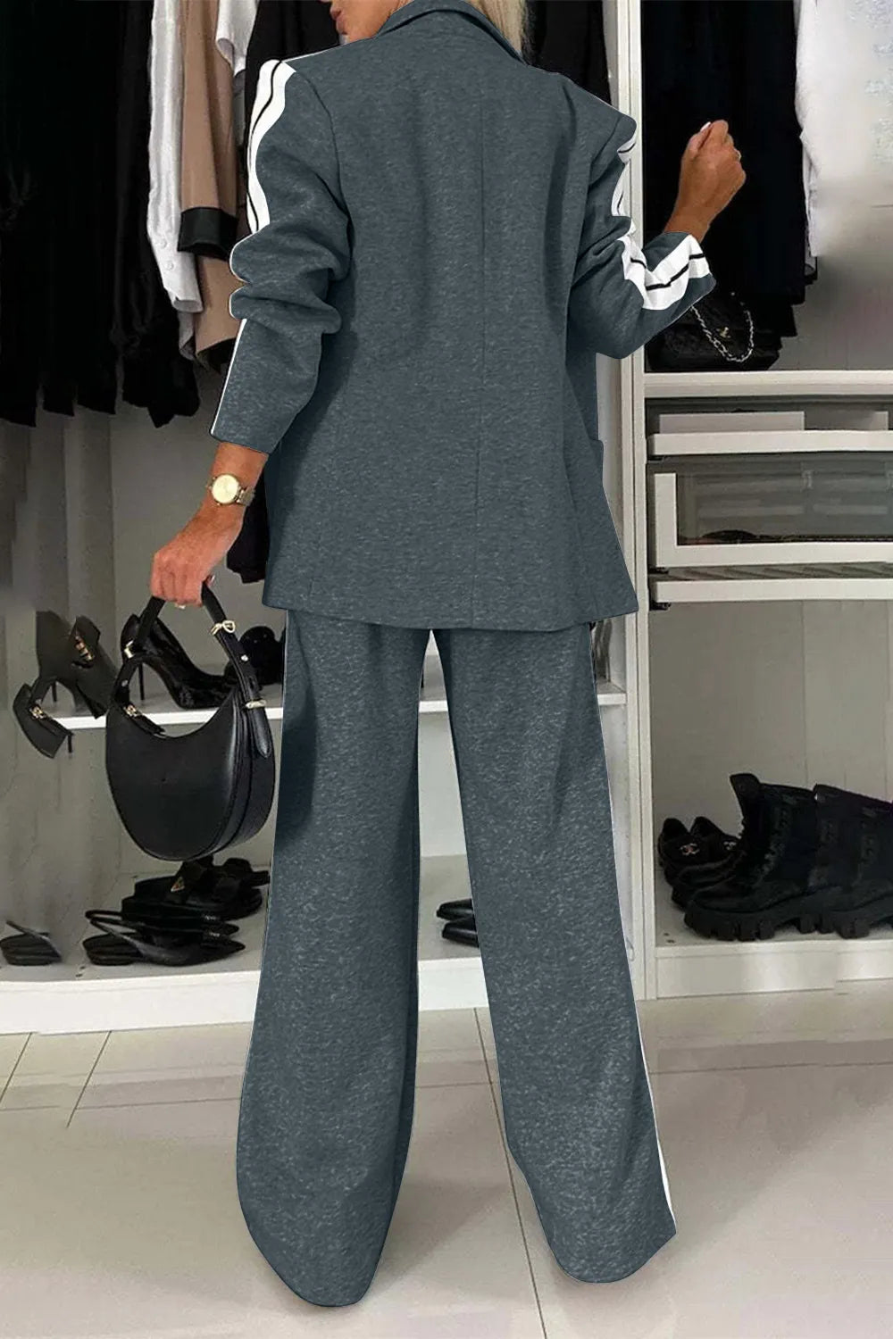 Full size contrast lapel collar top and pants set from Trendsi, featuring a stylish coordinated outfit with a lapel collar design.