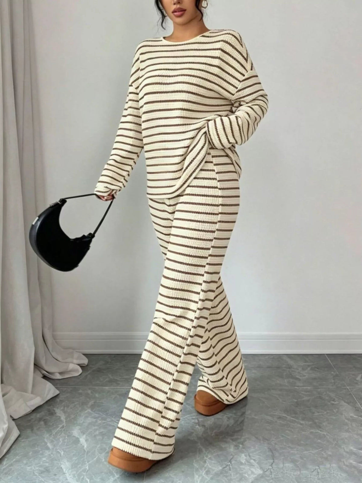 Striped relaxed fit top and pants set by Trendsi, featuring comfortable casual wear with a stylish striped pattern.