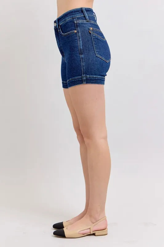 Plus size Judy Blue high waist denim shorts with tummy control, showcasing a flattering fit and classic denim look.