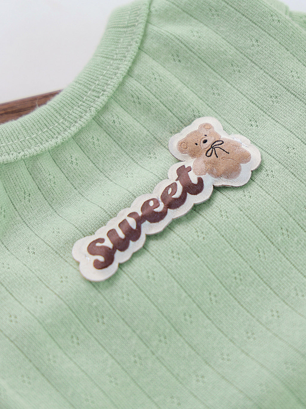 Cute ribbed pet top with a sweet bear patch, designed for small dogs, from Trendsi. Comfortable, stylish pet apparel.