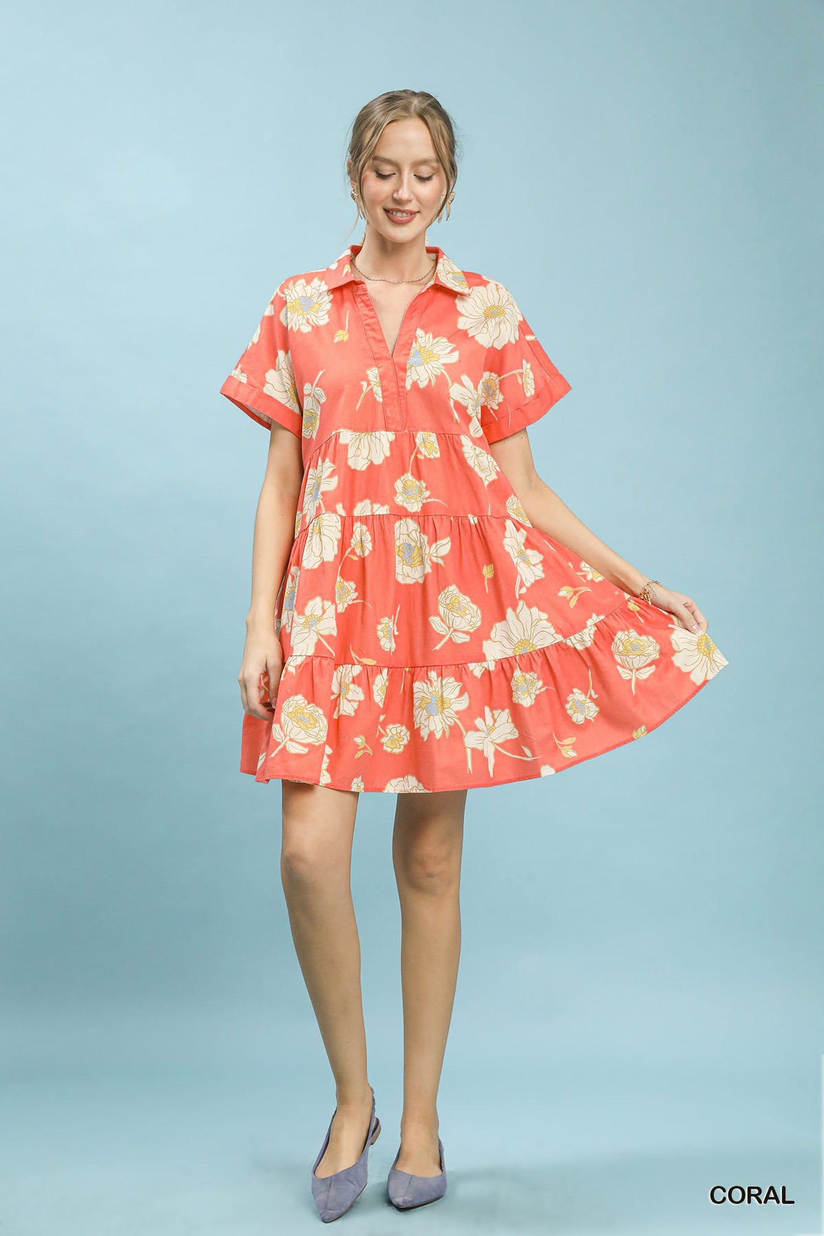 Umgee floral tiered collared babydoll dress featuring a relaxed fit with a button-up front and tiered skirt, perfect for casual wear.
