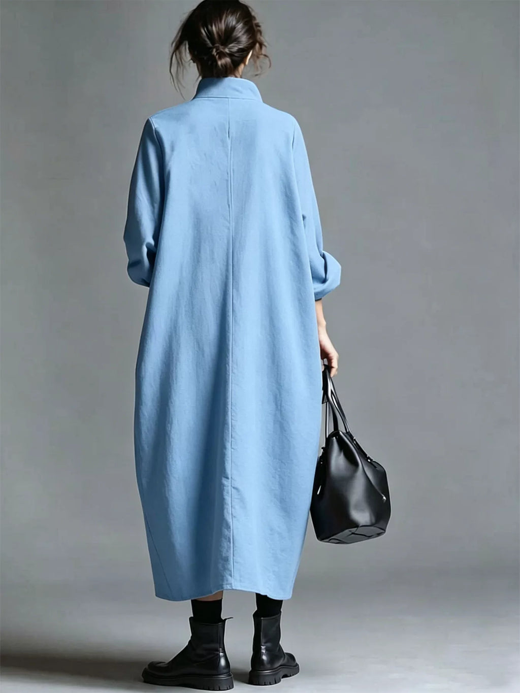 Plus size loose-fit mock neck midi dress with pockets by Trendsi, featuring a full-size, comfortable design and stylish silhouette.