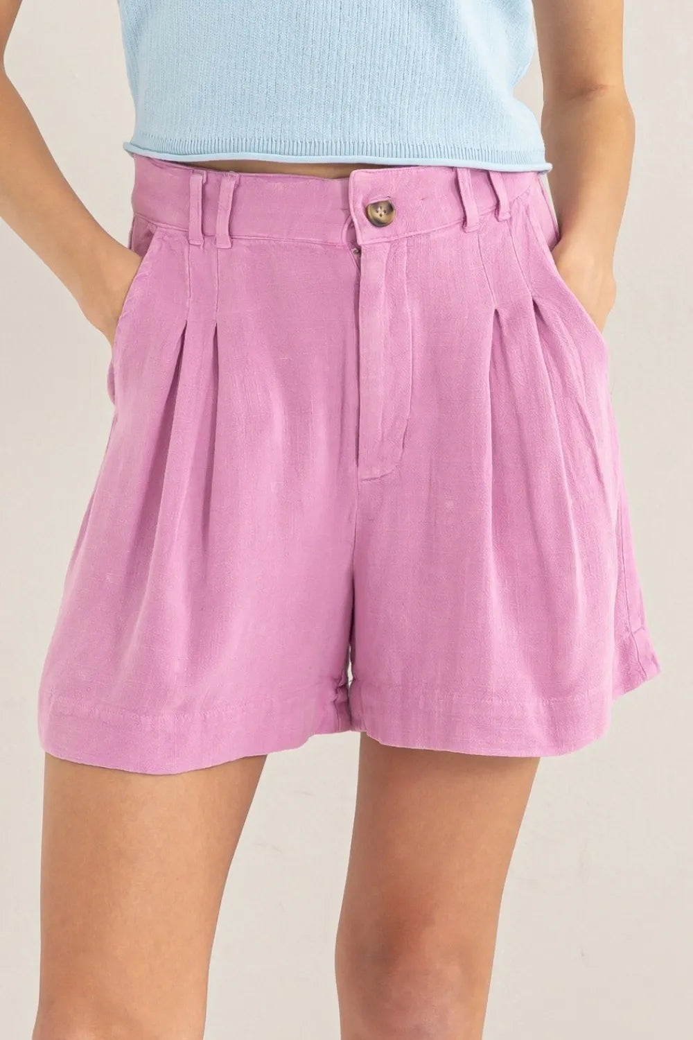 High waist linen shorts with pleats from HYFVE, featuring a relaxed fit and light fabric perfect for warm weather.