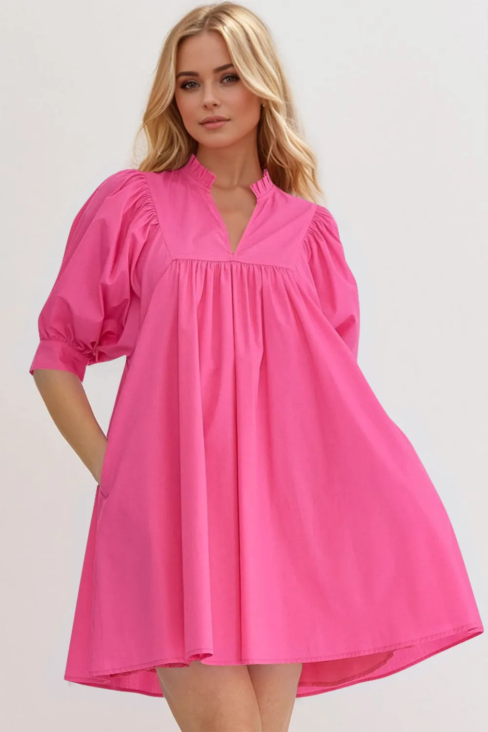 Pink notched puff sleeve babydoll mini dress with frill details, by Trendsi, shown on a hanger against a neutral background.
