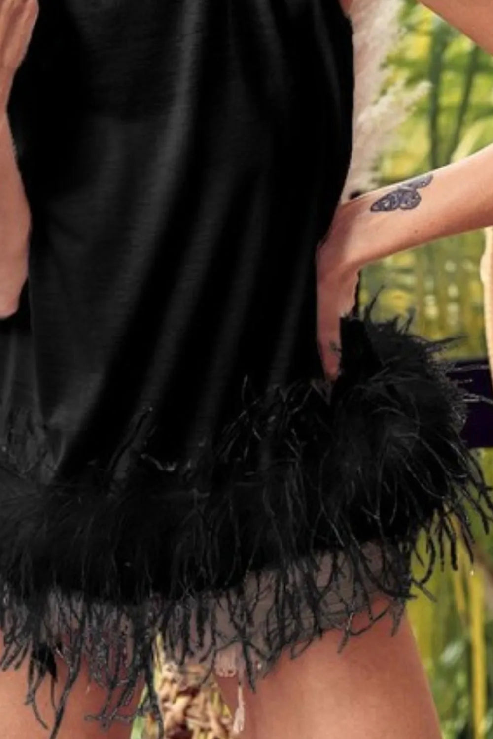 BiBi French Terry faux feather bottom back tied top by Trendsi, featuring a relaxed fit and stylish back tie detail.
