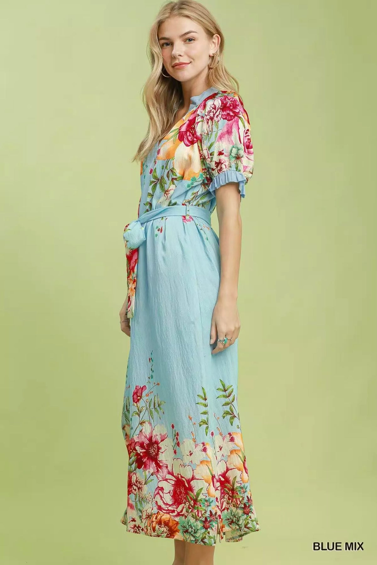 Umgee floral border print midi dress featuring a colorful mixed floral pattern and a flowy silhouette.