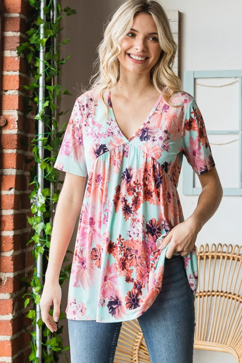 Heimish floral V-neck short sleeve babydoll blouse with a full size fit, featuring a feminine floral pattern and lightweight fabric.