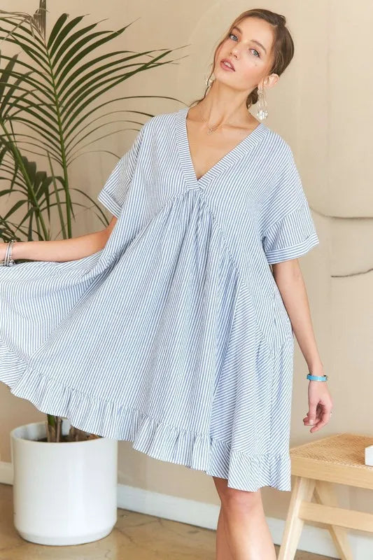 Trendsi ADORA ruffled hem striped V-neck babydoll dress with flowy fabric and feminine design, perfect for casual summer wear.