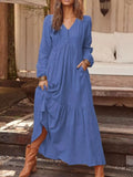 Plus size V-neck long sleeve tiered maxi dress with pockets from Trendsi, featuring a full-length design and comfortable fit.