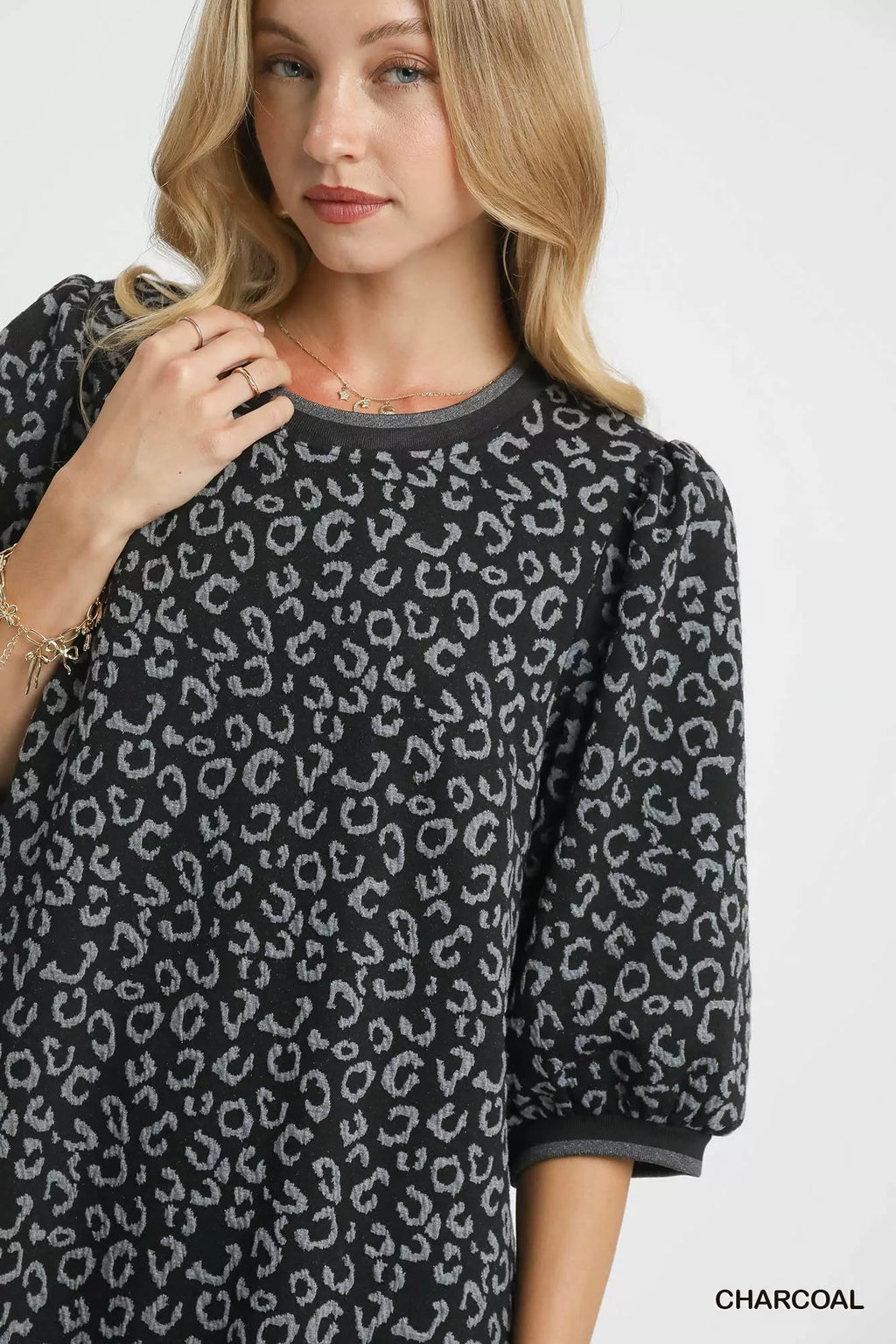 Umgee leopard print jacquard mini dress with long sleeves and fitted silhouette, stylish and trendy for casual or dressy occasions.