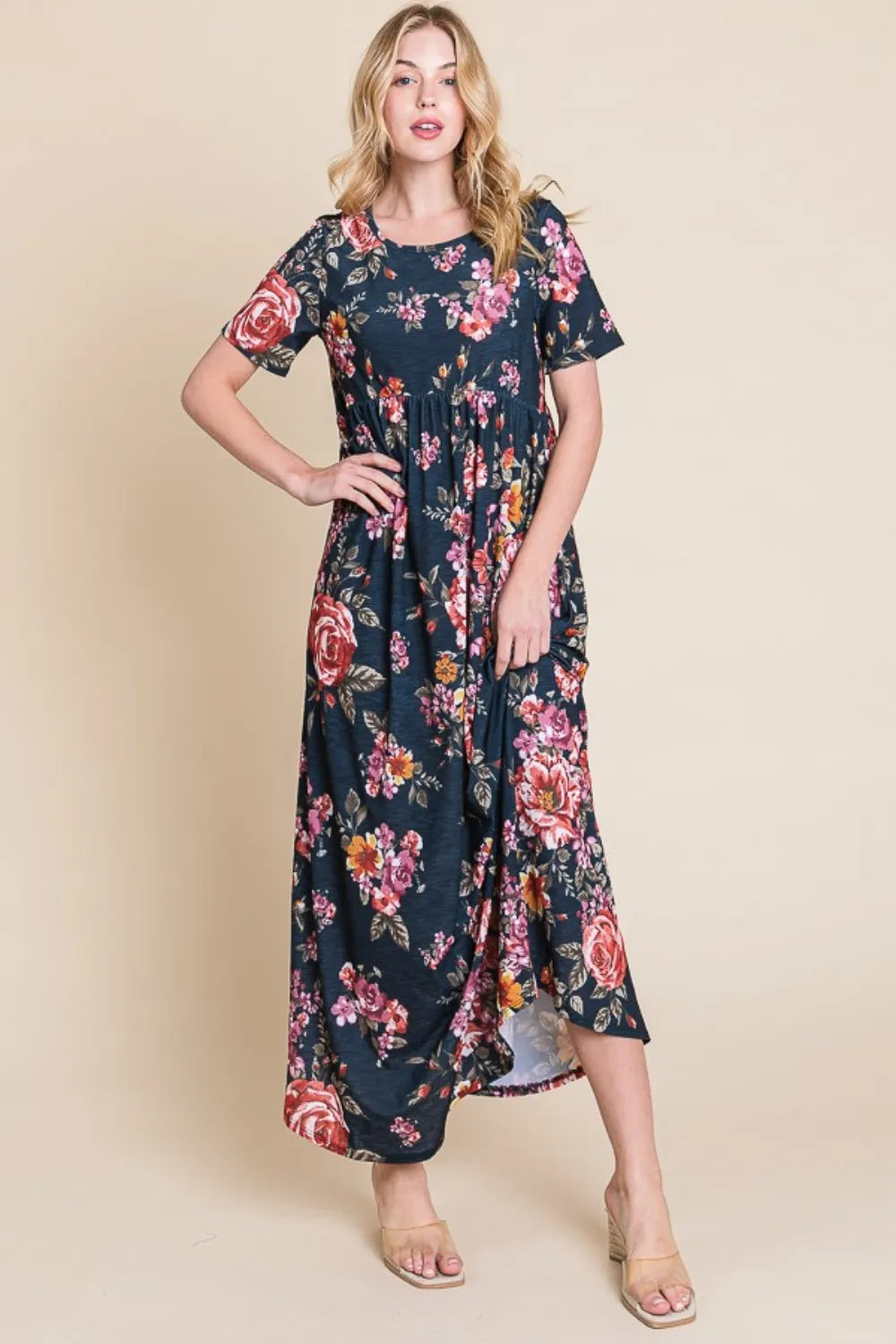 Floral BOMBOM maxi dress with short sleeves from Trendsi, featuring a flowing silhouette and vibrant floral pattern.