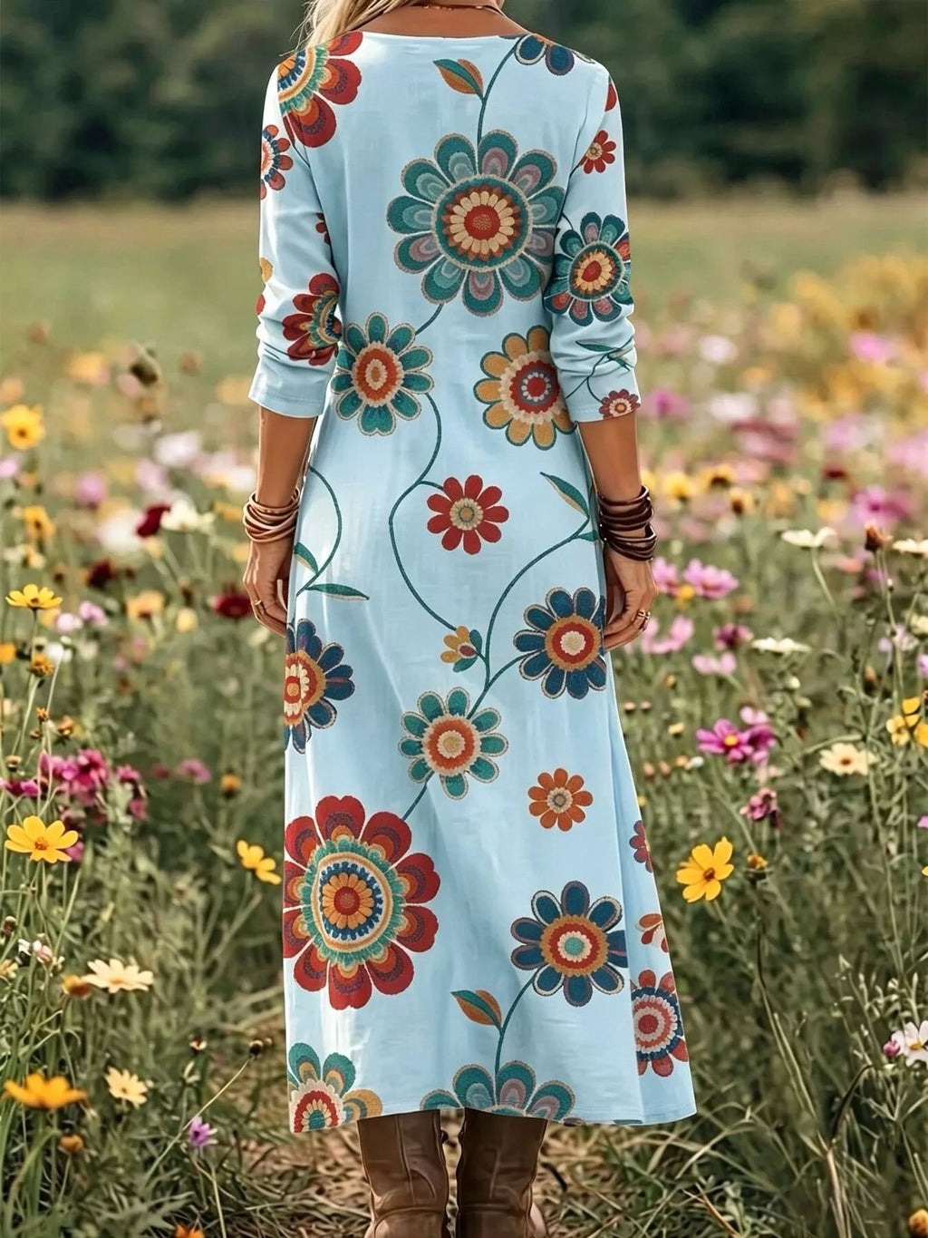 Floral print V-neck long sleeve maxi dress by Trendsi, flowing fabric with vibrant floral pattern and elegant design.