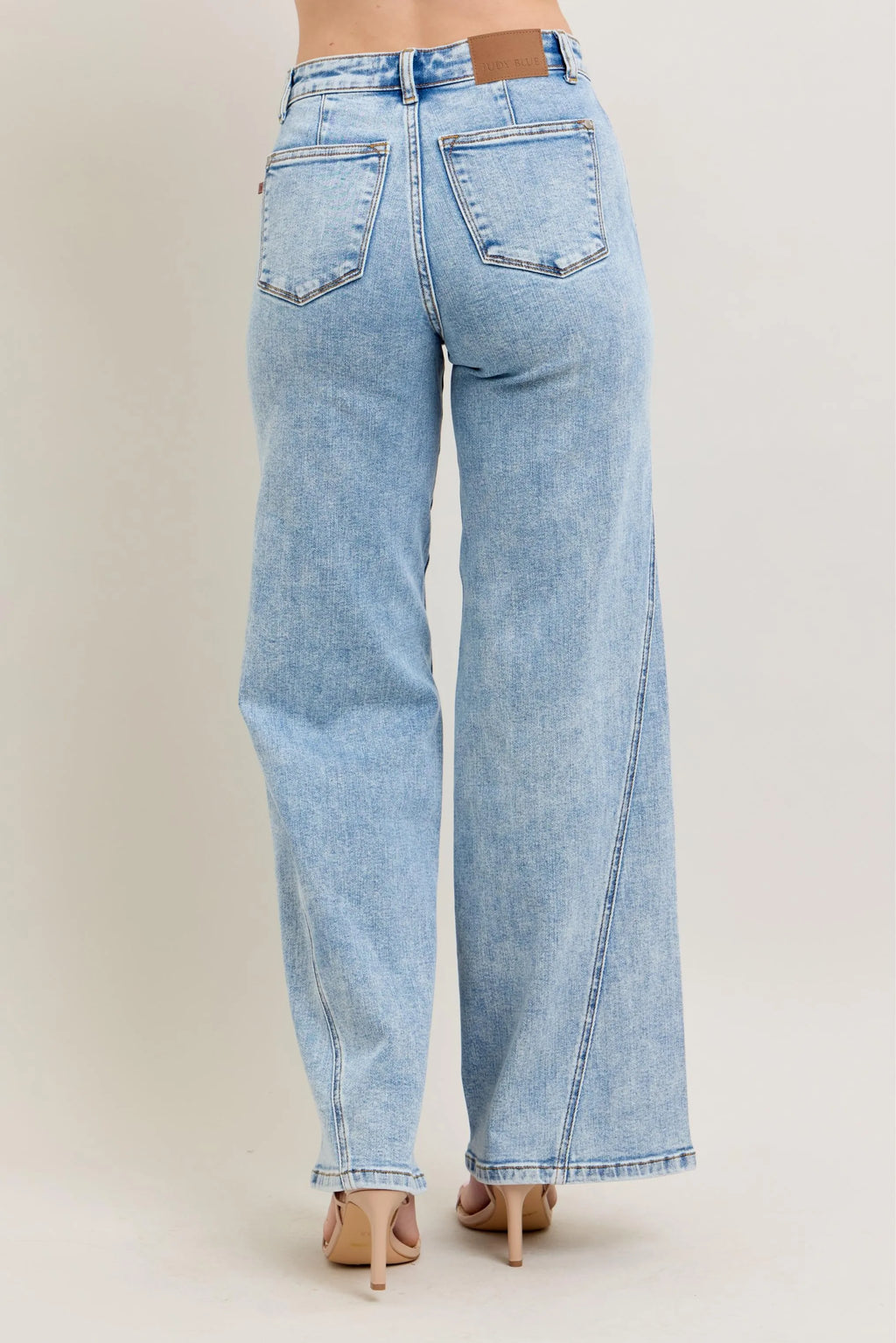 Plus size Judy Blue high waist wide leg jeans with skewed inseam, featuring a full-length fit and trendy denim style.