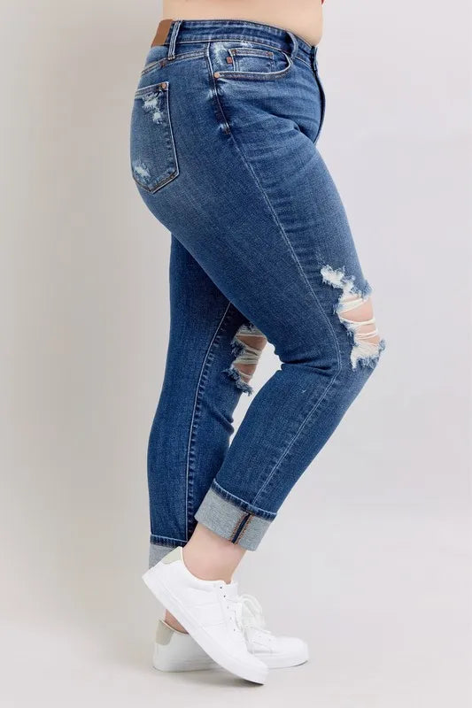 Trendsi Judy Blue boyfriend jeans with mid-rise fit, distressed details, yoke pockets, and faux selvedge cuff in plus size.