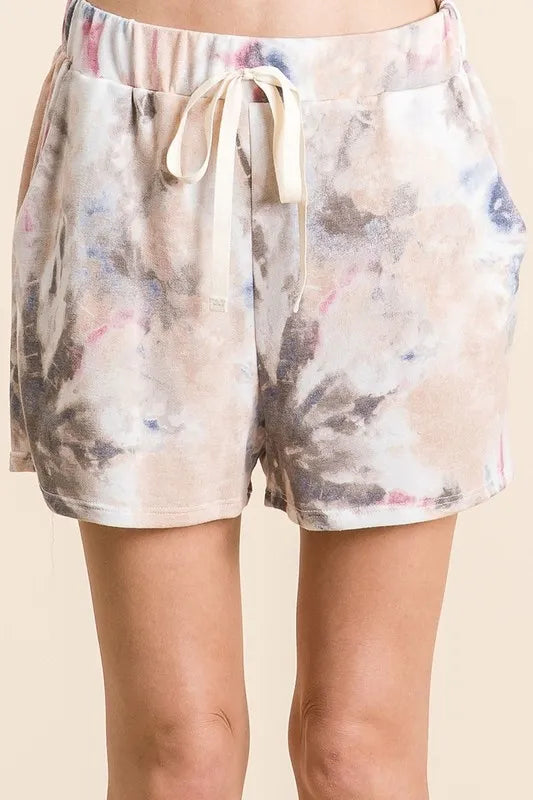 Colorful tie dye Terry shorts with drawstring waist from Trendsi, casual summer style, close-up of fabric and waistband detail.