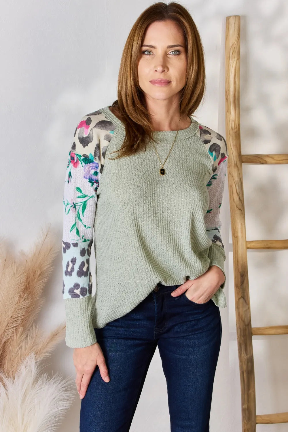 Printed round neck blouse from Hailey & Co by Trendsi, shown in a full size, with a relaxed fit and vibrant print design.