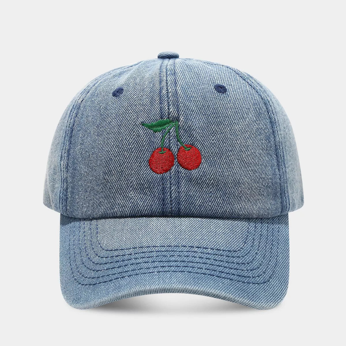 Cherry embroidery baseball cap by Trendsi featuring a white cap with colorful cherry design on the front.