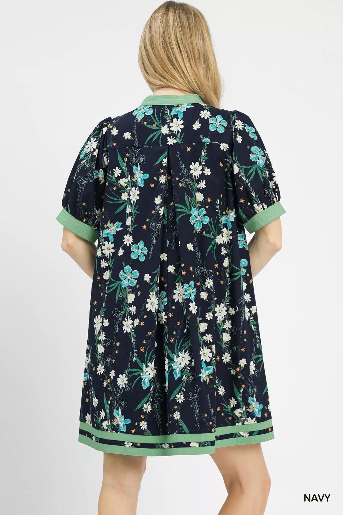 Umgee floral puff sleeve dress with contrast trim, featuring a feminine design and vibrant floral pattern.