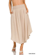 Woven crinkle maxi skirt by Trendsi with smocked waist and side pockets, featuring a flowing silhouette and textured fabric.