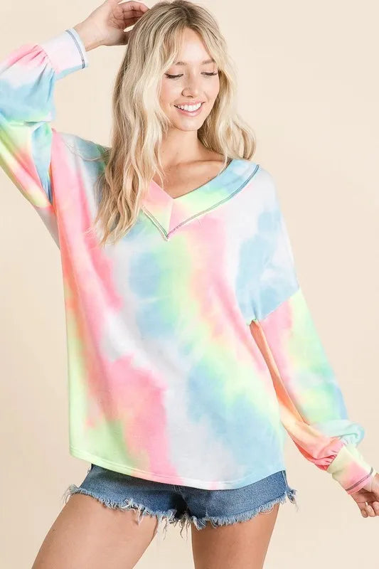 Pink and purple tie-dye French Terry V-neck top with puff sleeves from Trendsi, shown on a mannequin.