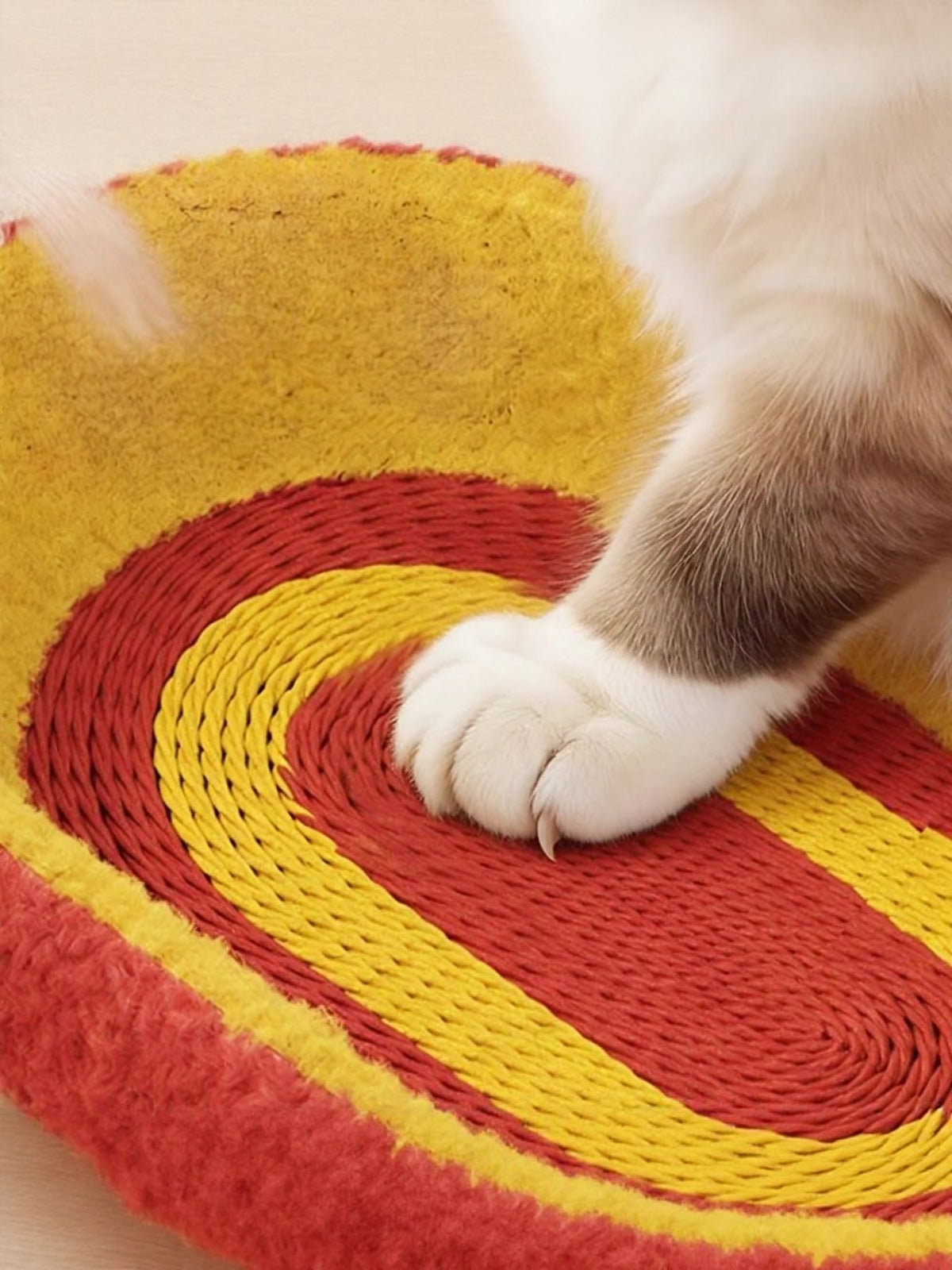 Oval cat scratching bed by Trendsi with soft plush surface, designed for cats to scratch and rest comfortably.