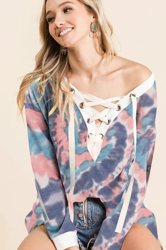 BiBi tie dye deep V-neck top with lace-up front, trendy boho style, colorful fabric, and relaxed fit.